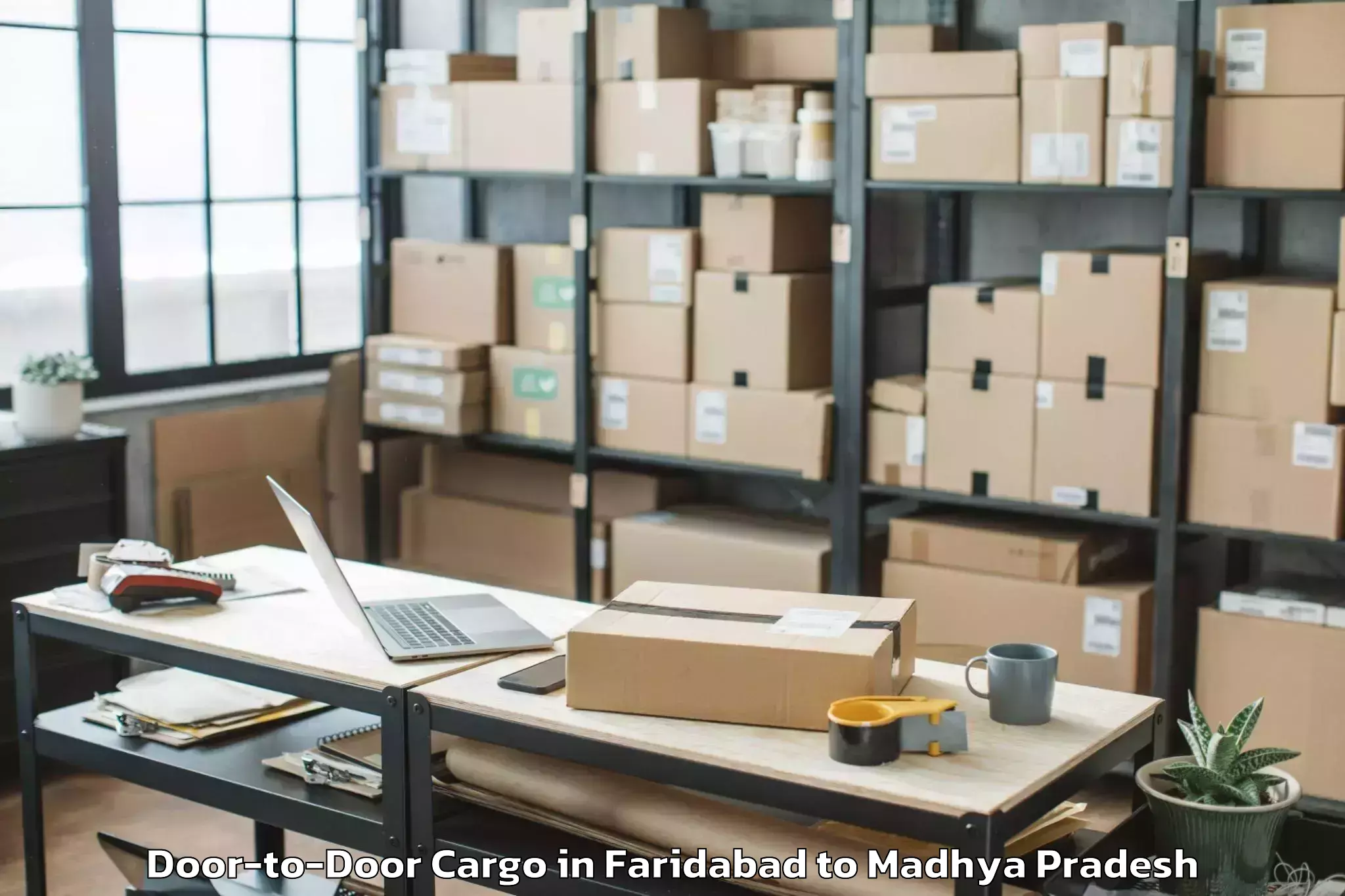 Leading Faridabad to Shajapur Door To Door Cargo Provider